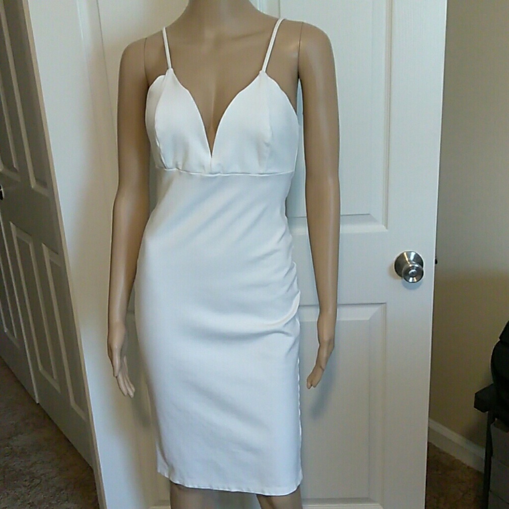 Sexy white low cut form fitting midi dress.